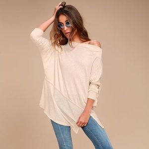 Free people off-the-shoulder light sweater/shirt.